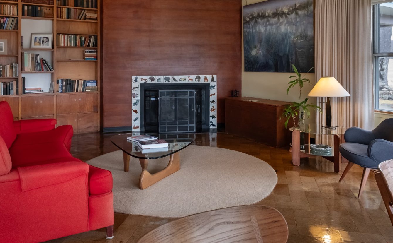 Common area living room with fireplace tiles by artist Carol Janeway