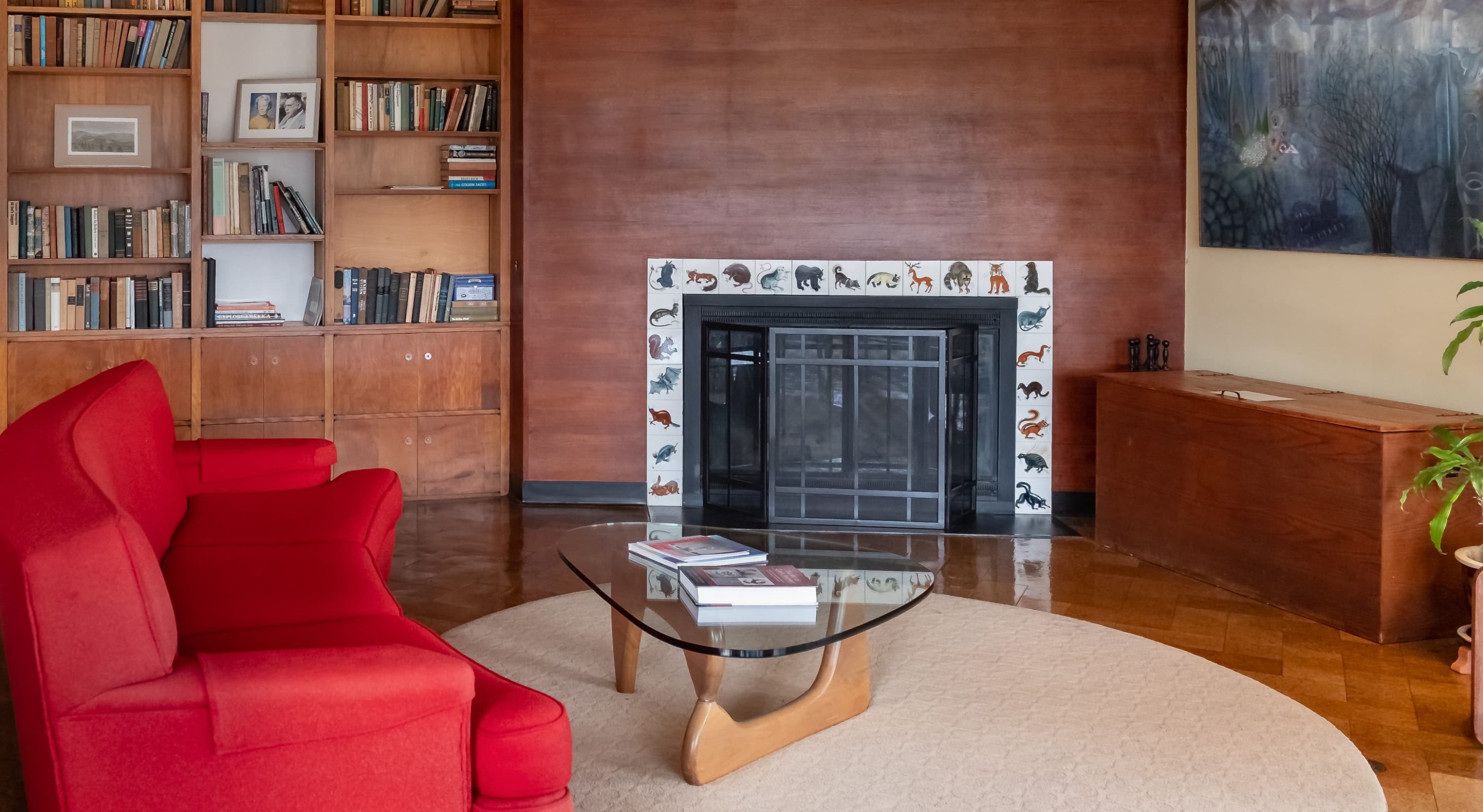 Common area living room with fireplace tiles by artist Carol Janeway