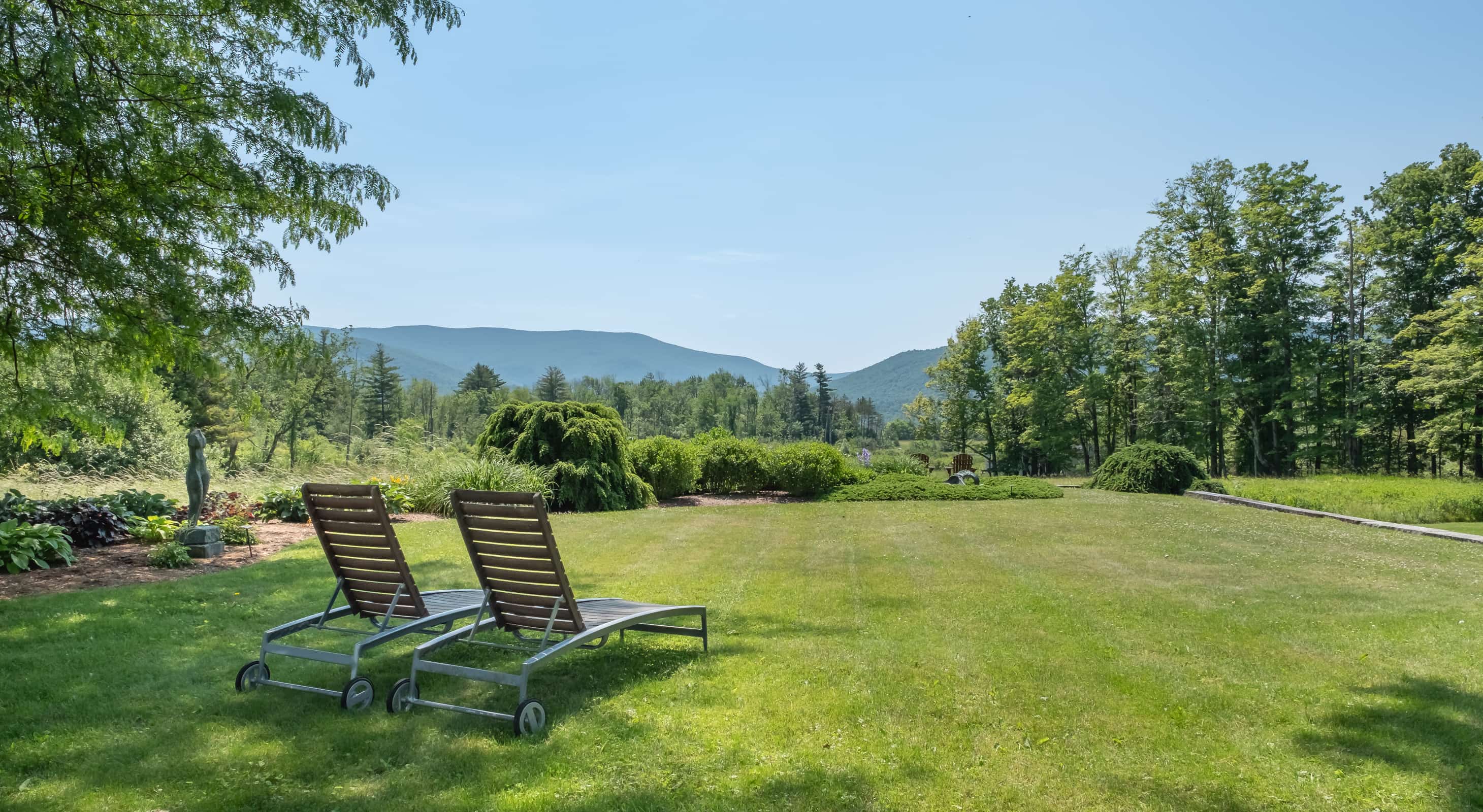 Lawns chairs in the shade of a tree