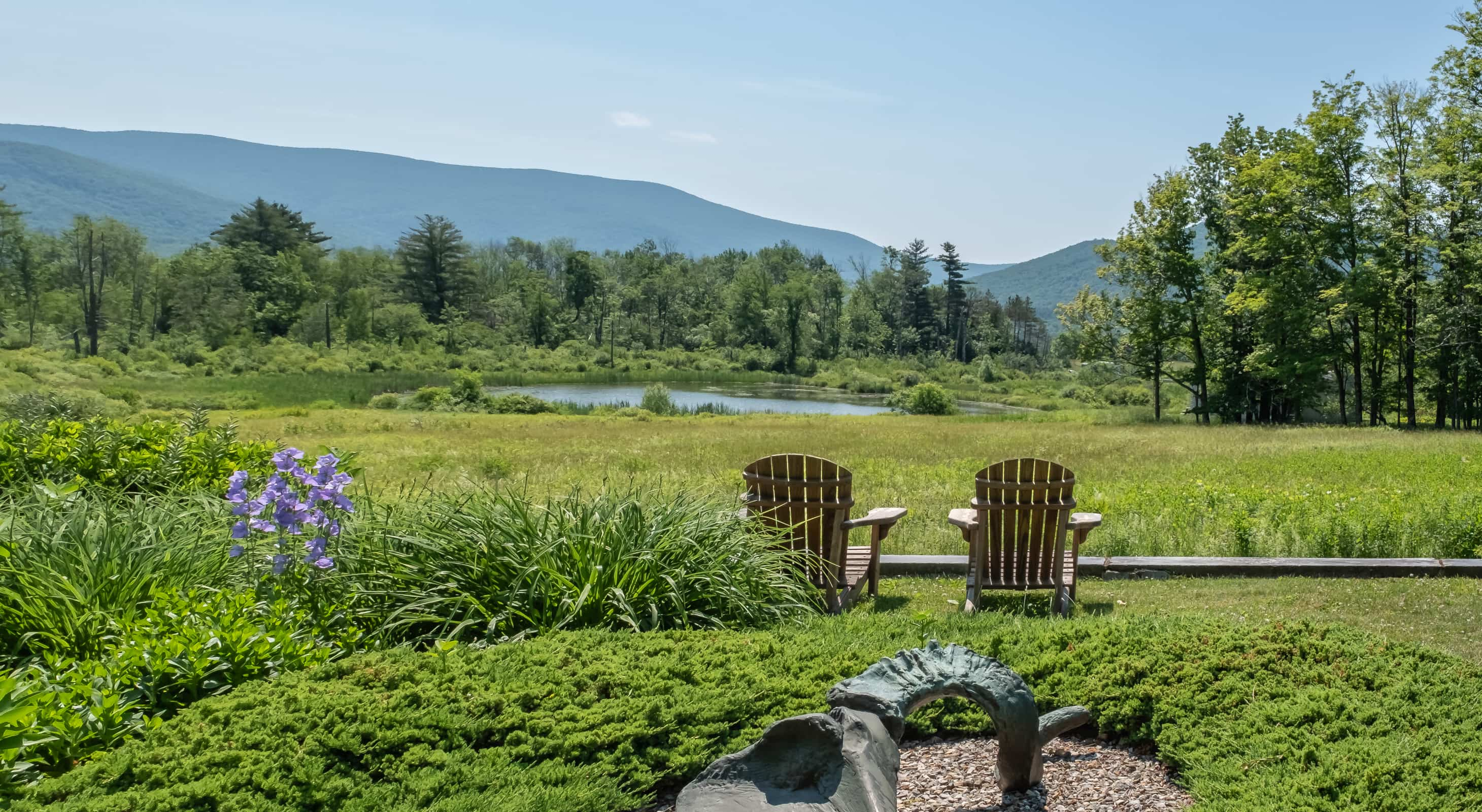 Adirondack chairs in the garden with mountain views at our Williamstown, MA inn