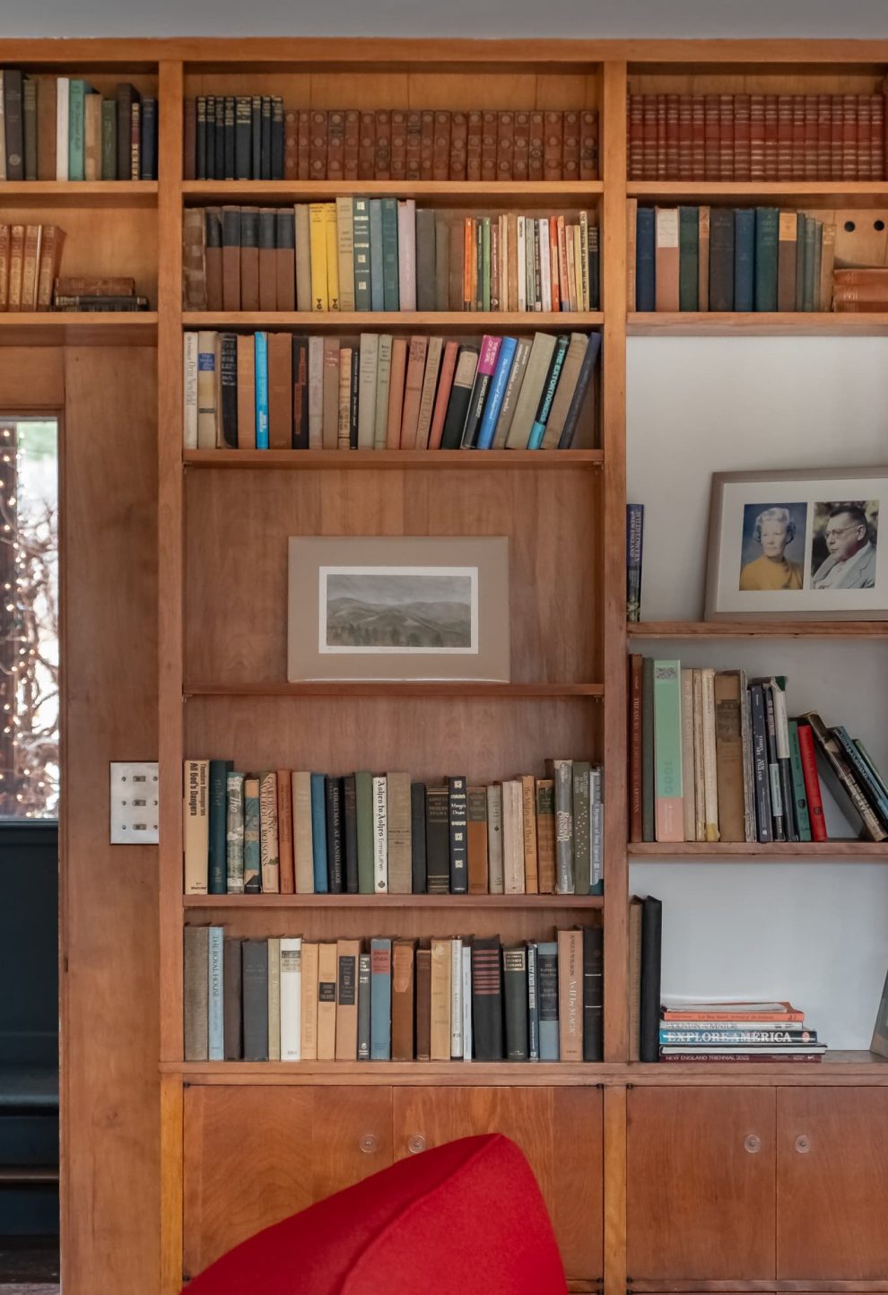 Floor-to-ceiling book shelf in the living area common space