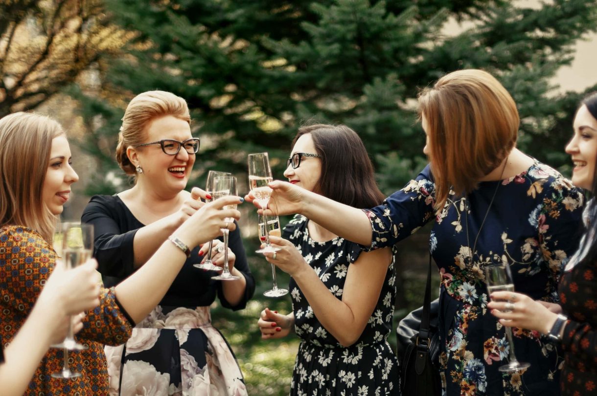 Women toasting glasses of wine