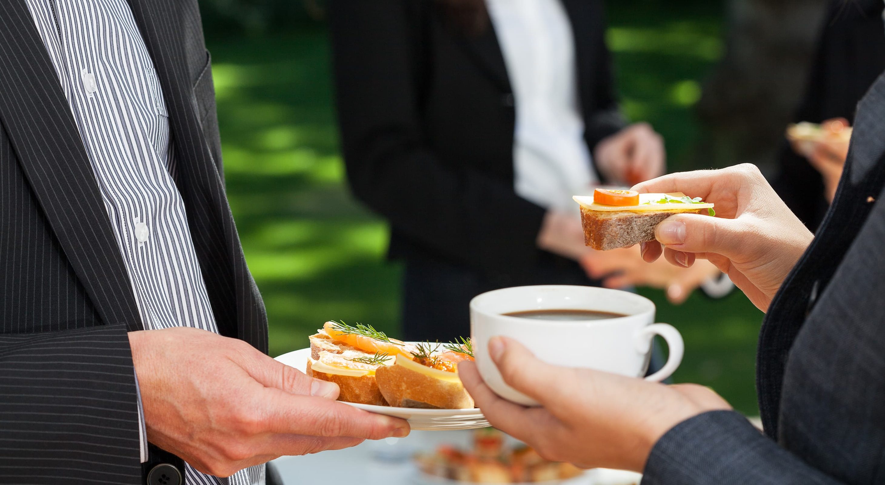 Outdoor event attendees enjoying hors d'oeuvres at Berkshires wedding venue in Williamstown