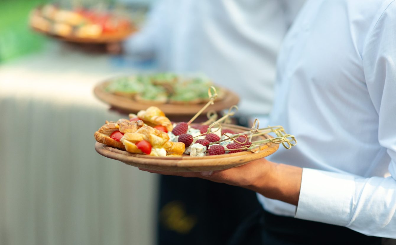 Event staff serving hors d'oeuvres