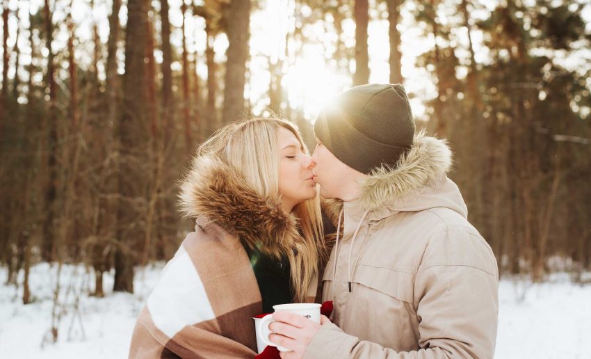 Couple outside kissing in winter in the Berkshires