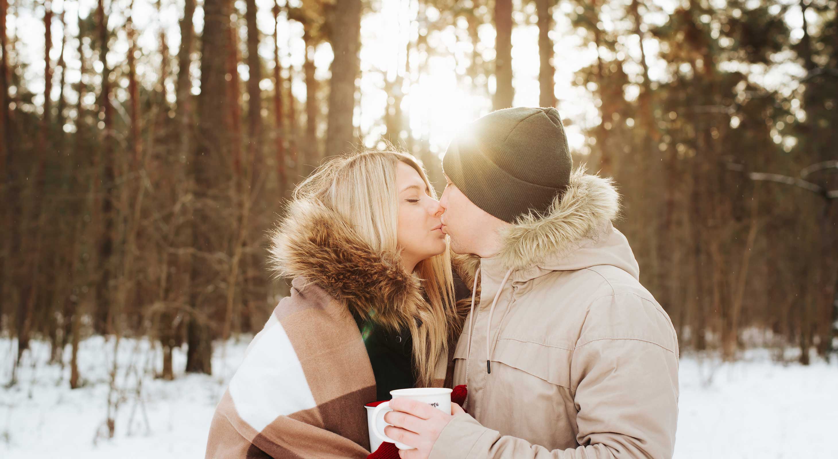 Couple outside kissing in winter in the Berkshires