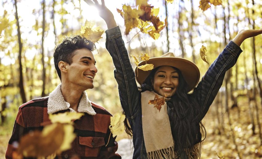 Couple playing in leaves in the Berkshires in fall