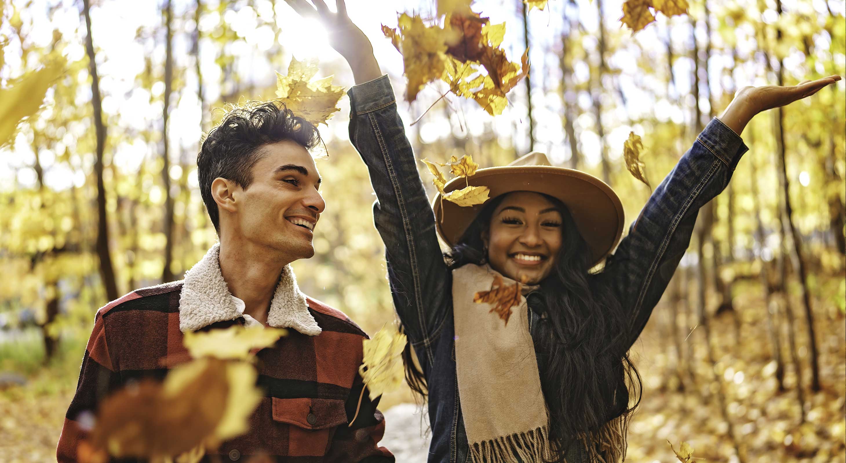 Couple playing in leaves in the Berkshires in fall