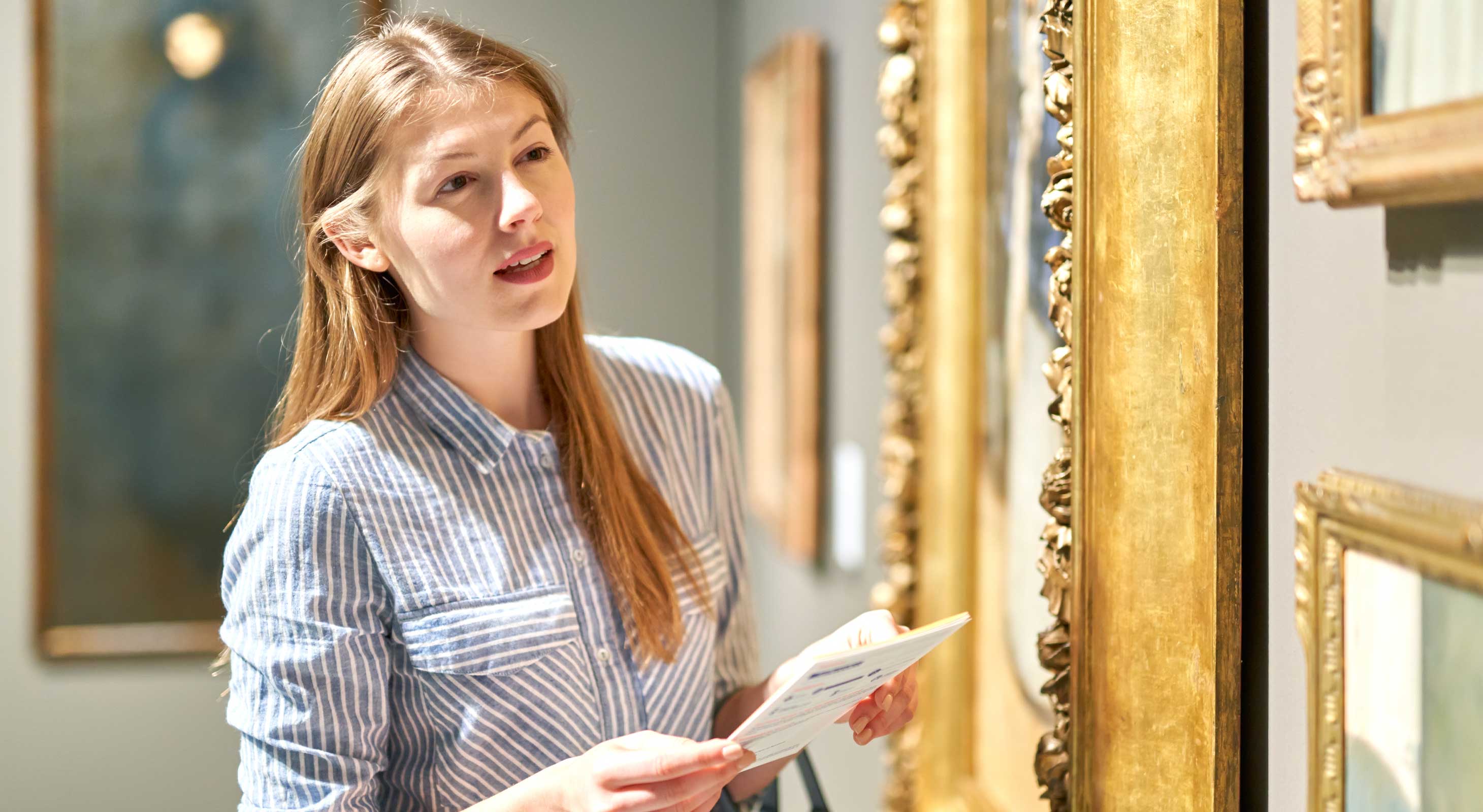 Woman looking at artwork